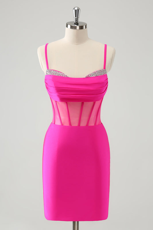 Robe de soirée moulante fuchsia scintillante à fines bretelles et corset ornée de perles