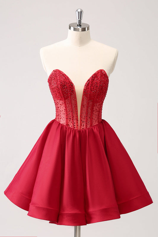 Jolie robe de bal courte évasée rouge bustier avec volants et perles