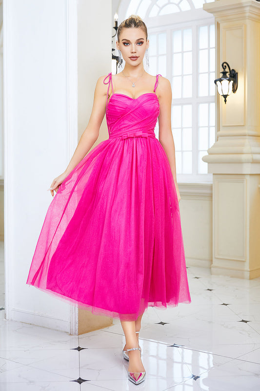 Robe de bal fuschia coupe trapèze à fines bretelles avec nœud