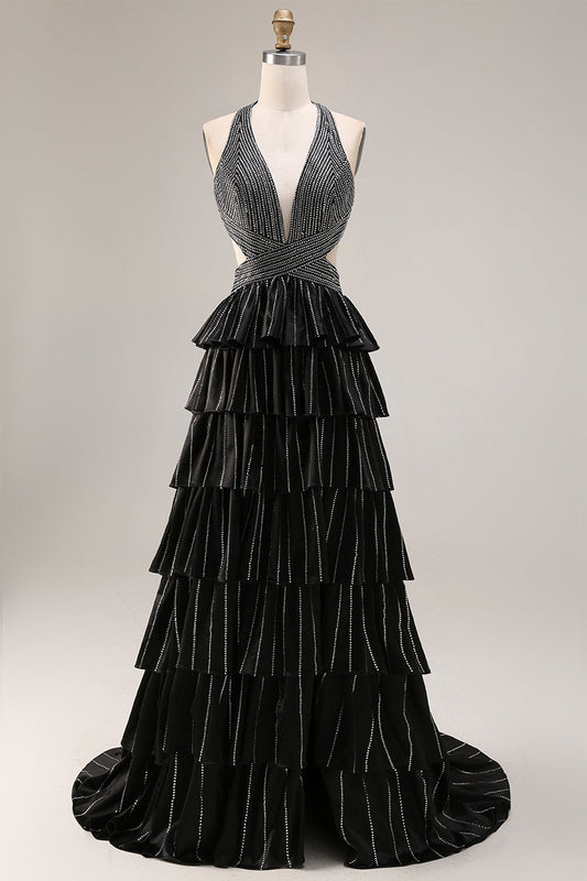 Robe de bal longue fendue noire trapÚze à volants étagés, dos nu perlé et col licou