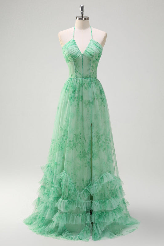 Robe de bal longue verte trapèze, dos nu, corset fleuri, volants, fendue