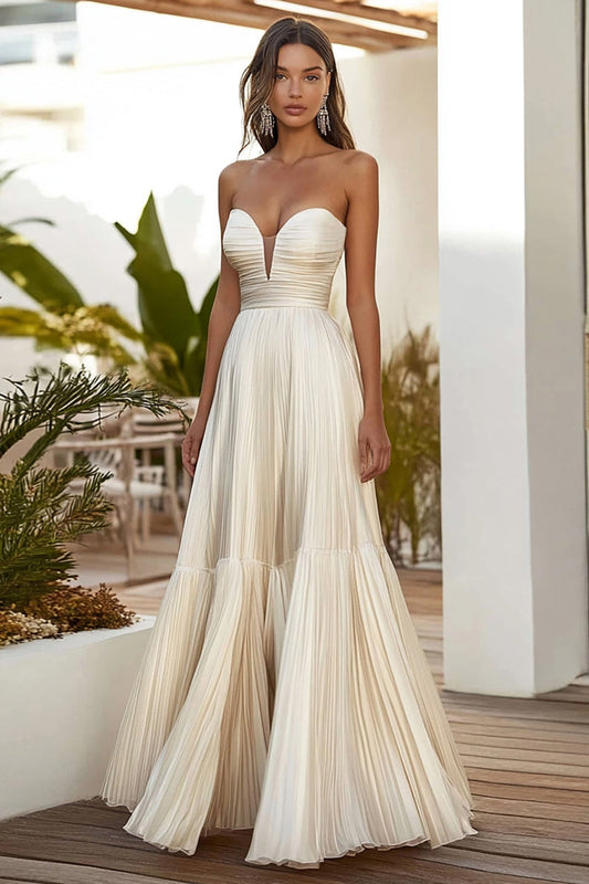Robe longue plissée bustier ligne A couleur champagne pour invitée de mariage