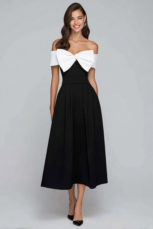 Robe longue de soirée trapèze, épaules dénudées, noire et blanche avec nœud