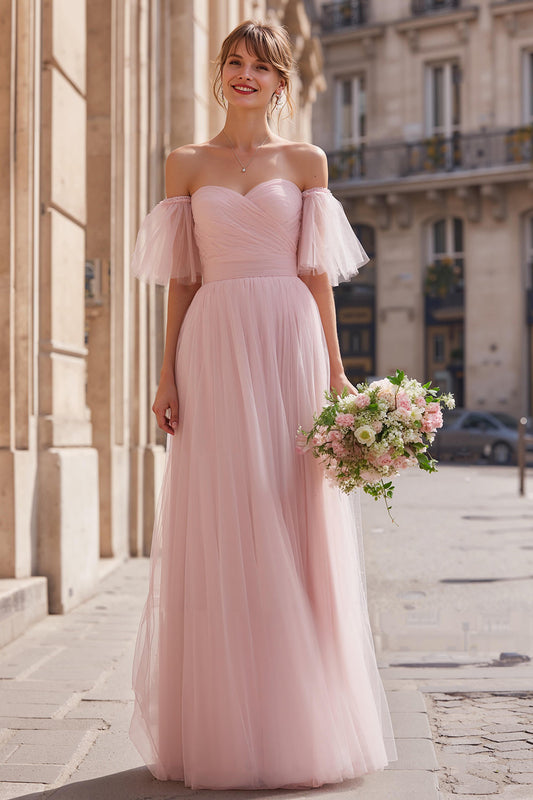 Robe de demoiselle d'honneur longue rose poudré épaules dénudées coupe évasée