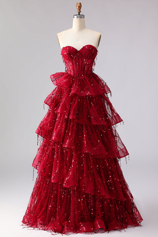 Robe de bal longue Princesse Scintillante Bordeaux avec bustier en cœur, franges et sequins à volants