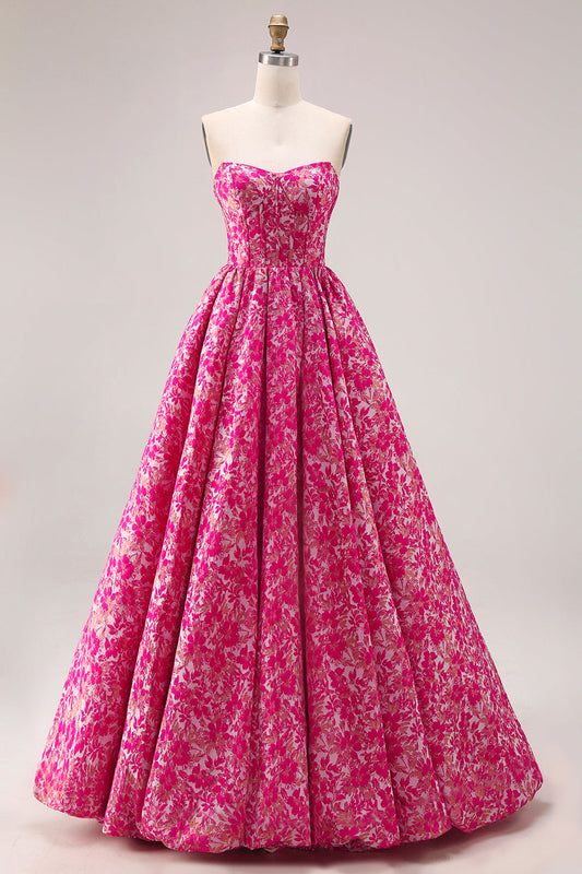 Robe de bal longue en jacquard fuchsia sans bretelles coupe trapèze avec corset