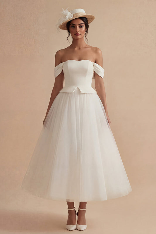 Robe de mariée longue bohème blanche coupe trapèze épaules dénudées