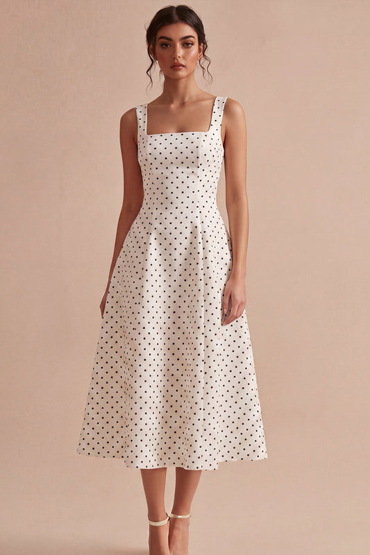 Robe mi-longue évasée à pois, avec de larges bretelles noires et blanches