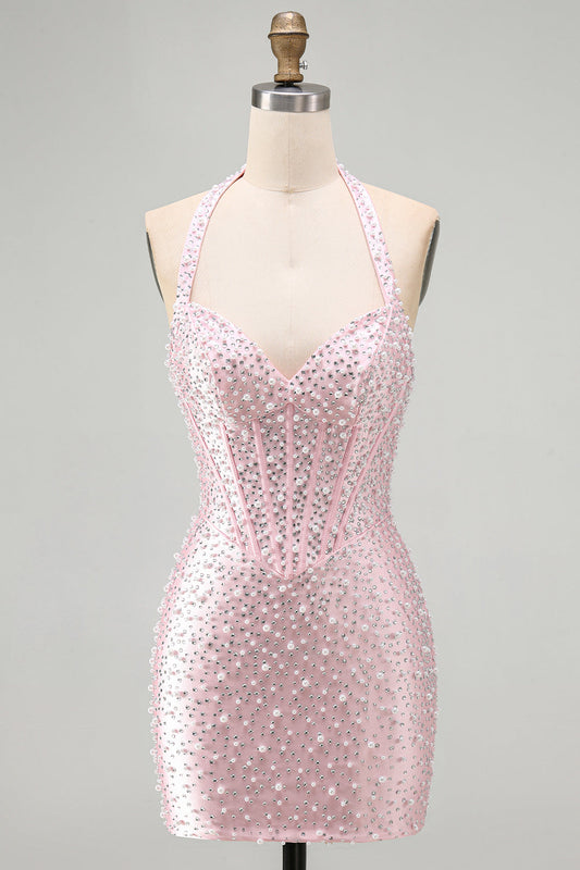 Robe courte de cocktail rose moulante dos nu à perles, corset et perles.