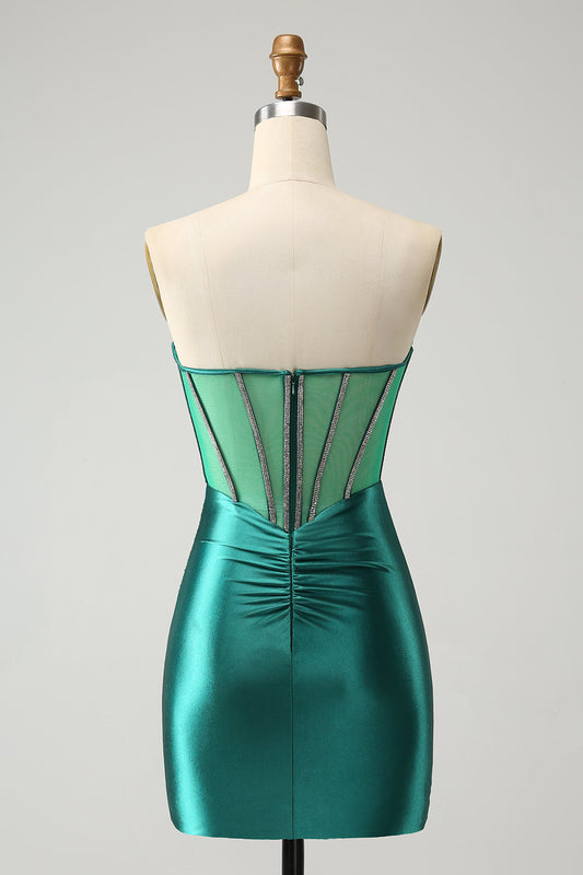 Robe moulante de cocktail avec corsage bustier et perles, vert foncé pailleté