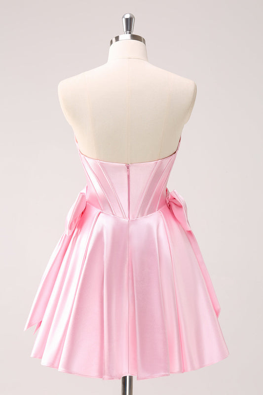 Robe de bal bustier rose ornée de perles avec nœuds