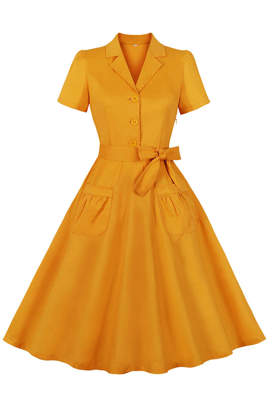 Robe jaune à revers crantés, ceinture à nœuds, style années 50, avec poches