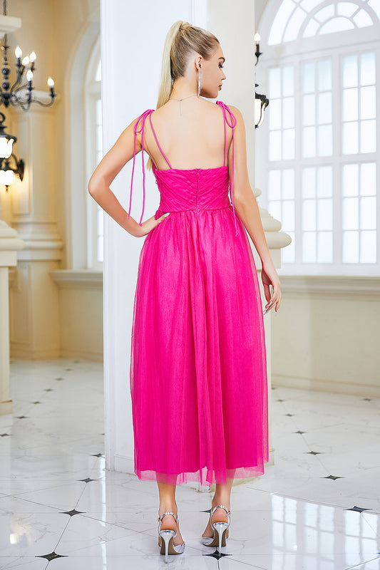 Robe de bal fuschia coupe trapèze à fines bretelles avec nœud