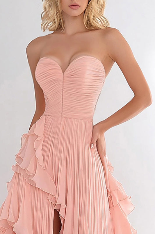 Robe de bal longue en mousseline rose coupe trapèze à volants