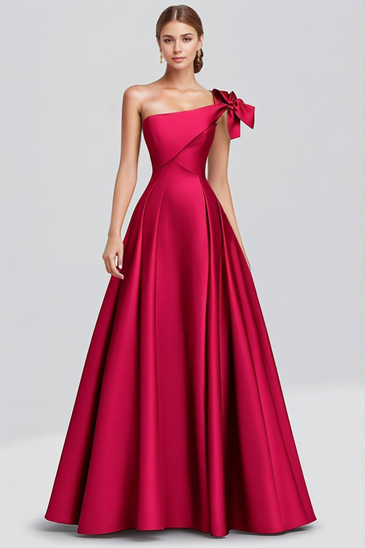 Robe longue de soirée fuchsia en satin coupe trapèze avec nœud et épaule unique