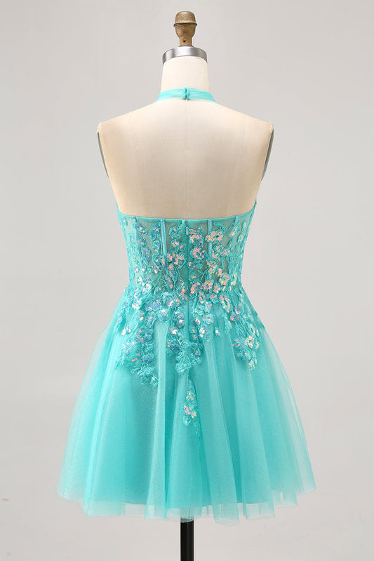 Robe de cocktail courte vert anis trapèze à licou avec applications