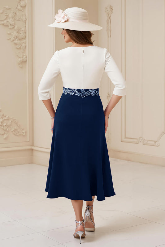 Robe midi de cérémonie bleu marine, coupe trapèze, encolure bateau, manches 3/4 avec appliqués