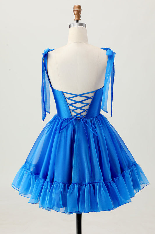 Robe de cocktail bleu roi trapèze à fines bretelles et volants