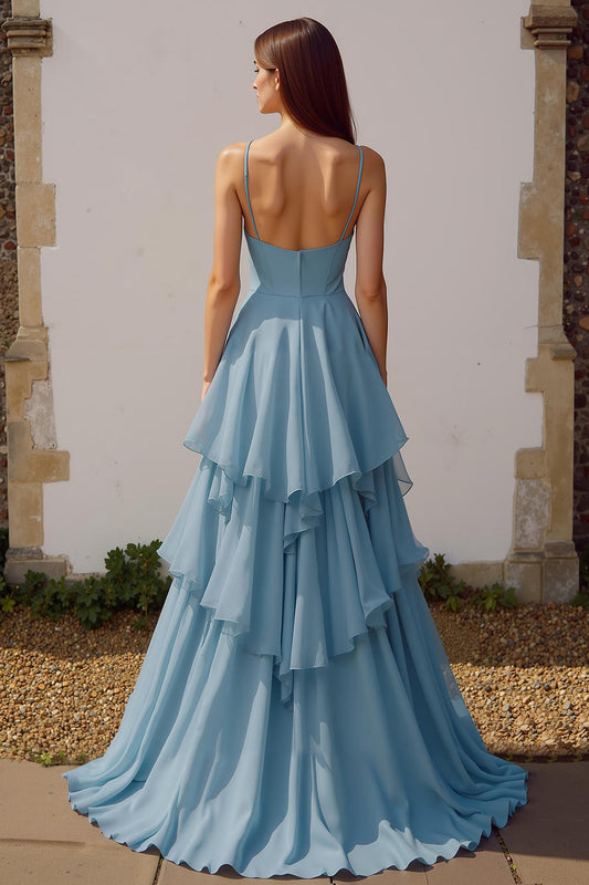 Robe de demoiselle d'honneur longue bleu poudré en mousseline à bretelles spaghetti et volants, coupe trapèze