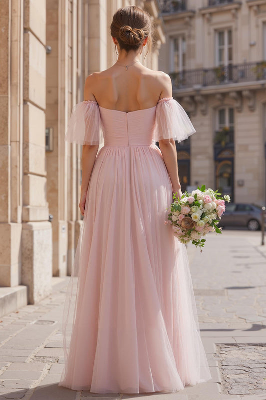Robe de demoiselle d'honneur longue rose poudré épaules dénudées coupe évasée