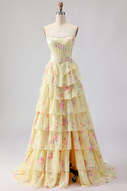 Robe de bal longue jaune sans bretelles, coupe trapèze avec corset, motif floral et jupe en mousseline à volants