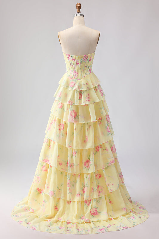 Robe de bal longue jaune sans bretelles, coupe trapèze avec corset, motif floral et jupe en mousseline à volants
