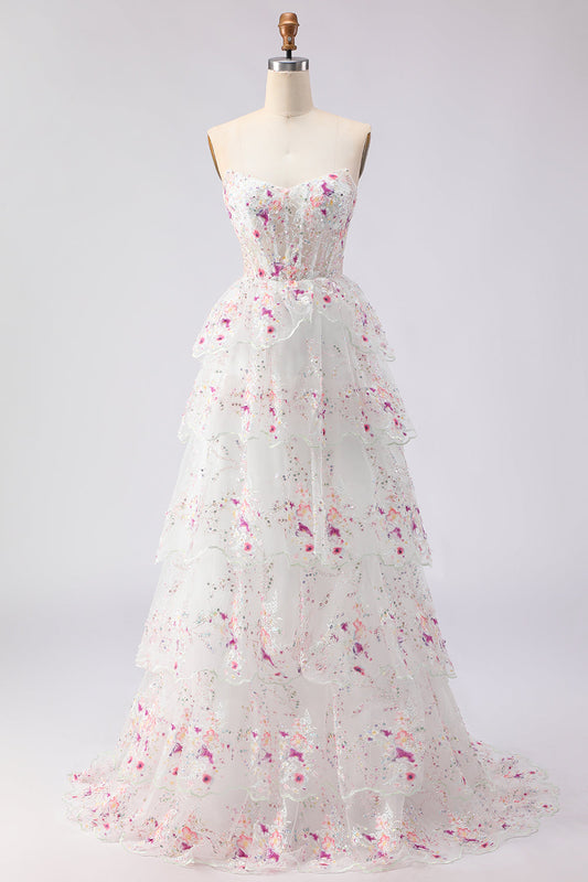 Robe de soirée longue trapèze à volants en tulle noir, fleurs roses, bustier, sequins, laçage au dos
