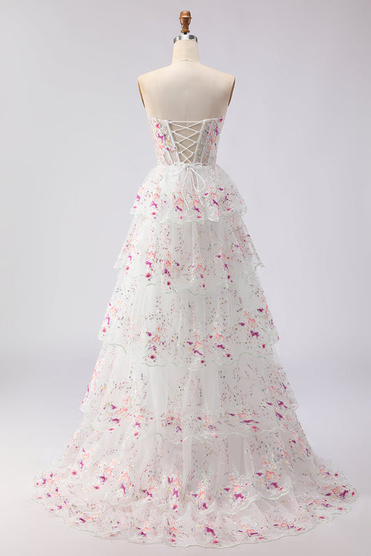 Robe de soirée longue trapèze à volants en tulle noir, fleurs roses, bustier, sequins, laçage au dos
