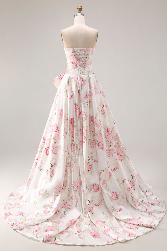 Robe de soirée longue trapèze sans bretelles, imprimée fleurs blanches et roses, avec nœud.