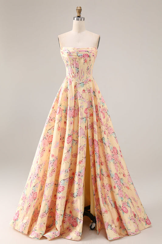 Robe de soirée longue sans bretelles ligne A taille basque avec fente et fleurs jaunes et roses