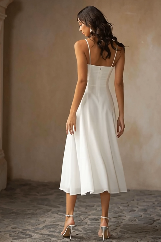 Robe de mariée mi-longue blanche en mousseline avec bretelles spaghetti et coupe trapèze