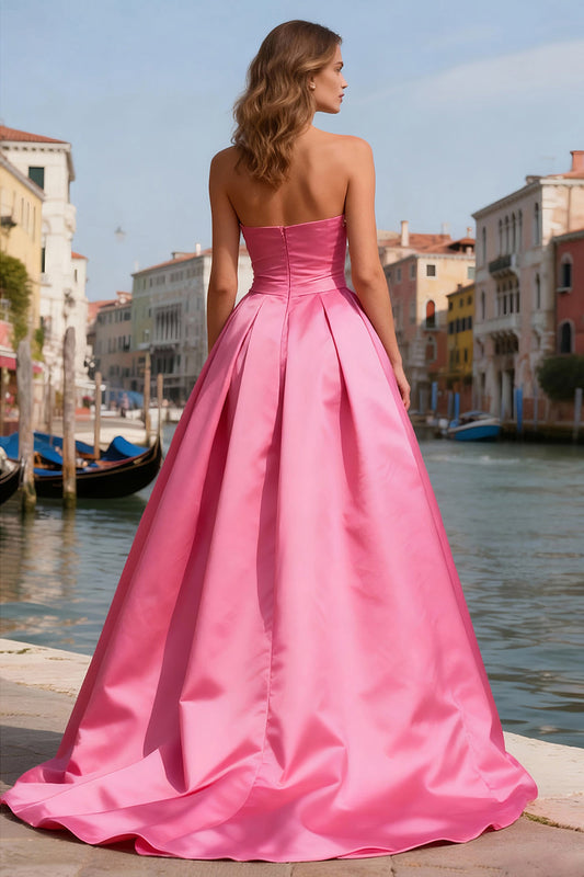 Robe de bal bustier rose vif coupe évasée avec perles