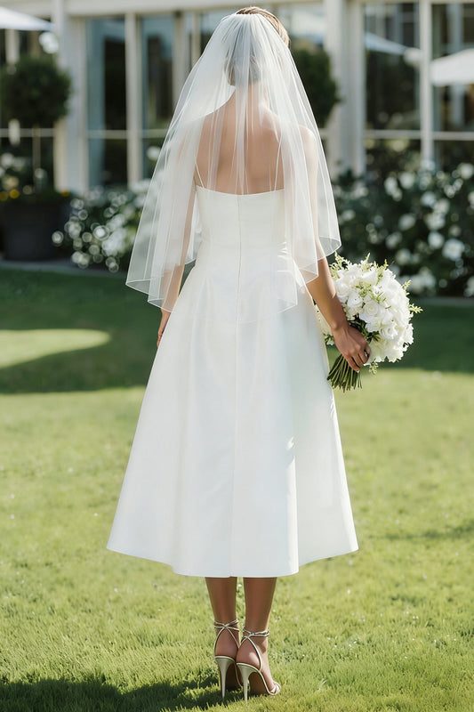 Robe de mariée midi évasée blanche à fines bretelles