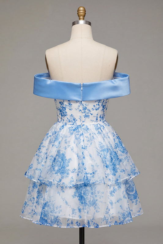 Robe de bal bleu trapèze, épaules dénudées, à motif floral et nœud