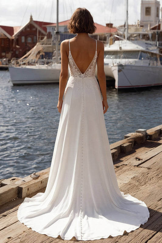 Robe de mariée sirène ivoire à corset, appliqués, fines bretelles et fente