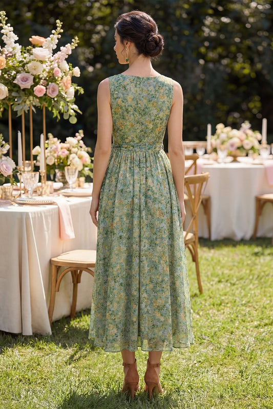 Robe mi-longue évasée à col en V et motif floral vert poussiéreux, froncée, avec nœud