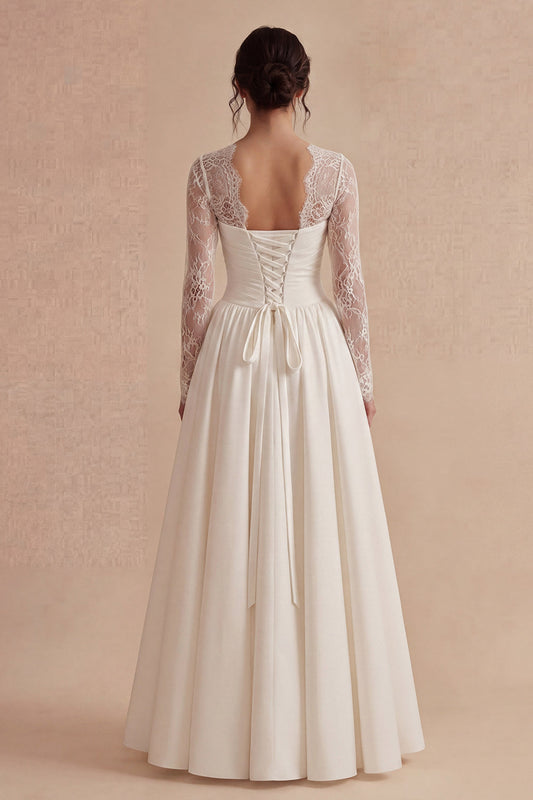 Robe de mariée longue bohème blanche en dentelle à manches longues et motif floral coupe trapèze