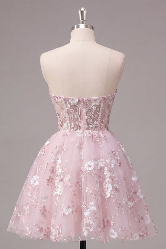 Robe de bal bustier rose évasée avec corset et motifs floraux