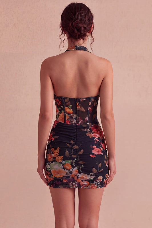 Mini-robe fourreau noire de cocktail, licol, ornée de fleurs et corset transparent