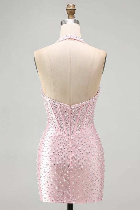 Robe courte de cocktail rose moulante dos nu à perles, corset et perles.
