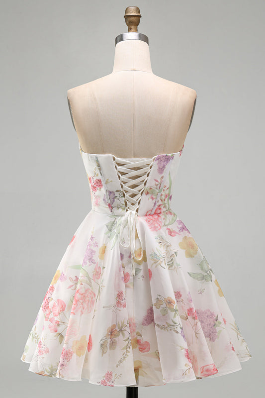 Robe de bal bustier coupe trapèze ivoire en mousseline de soie à fleurs avec corset froncé