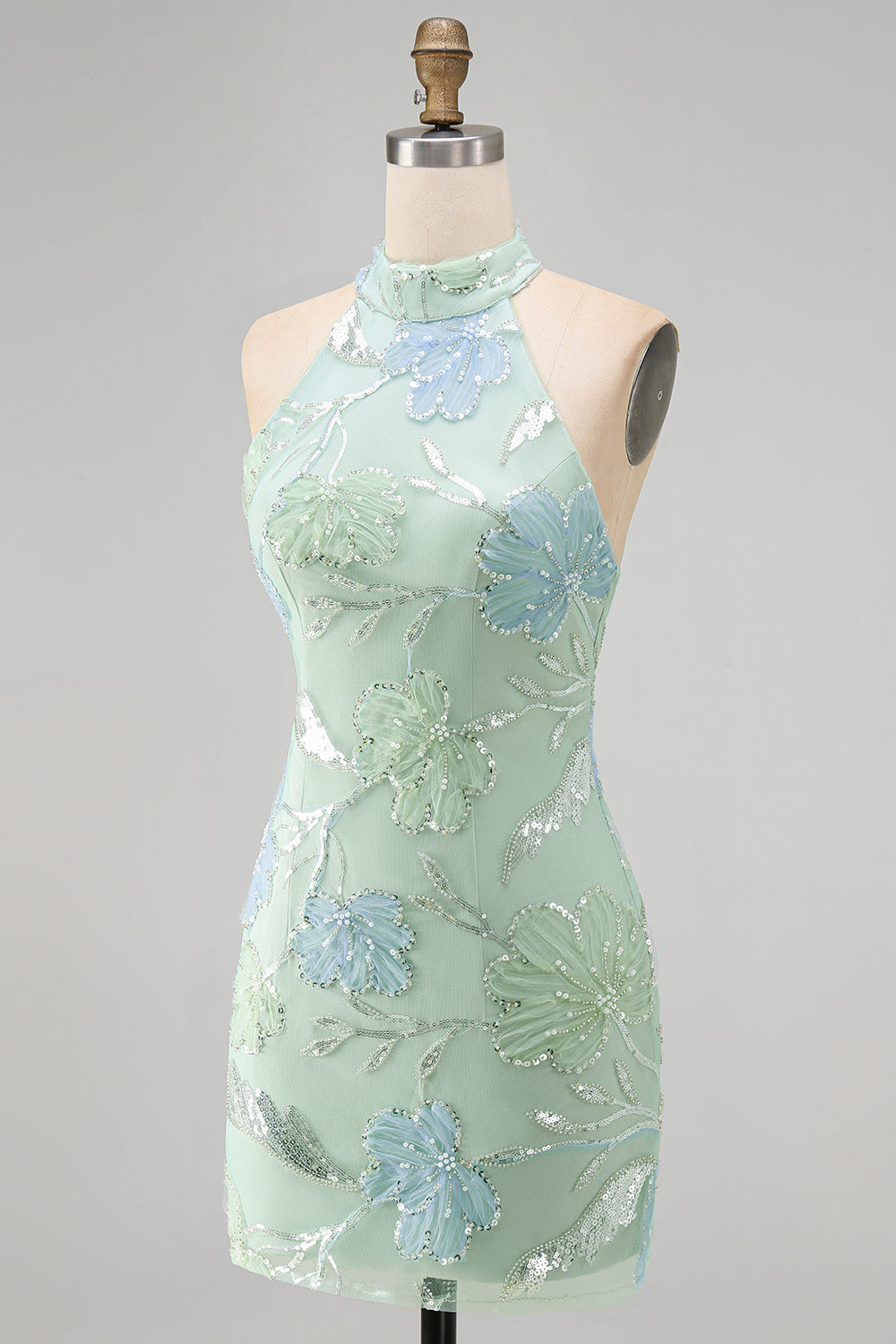 Robe de cocktail vert menthe moulante à licou et à sequins floraux