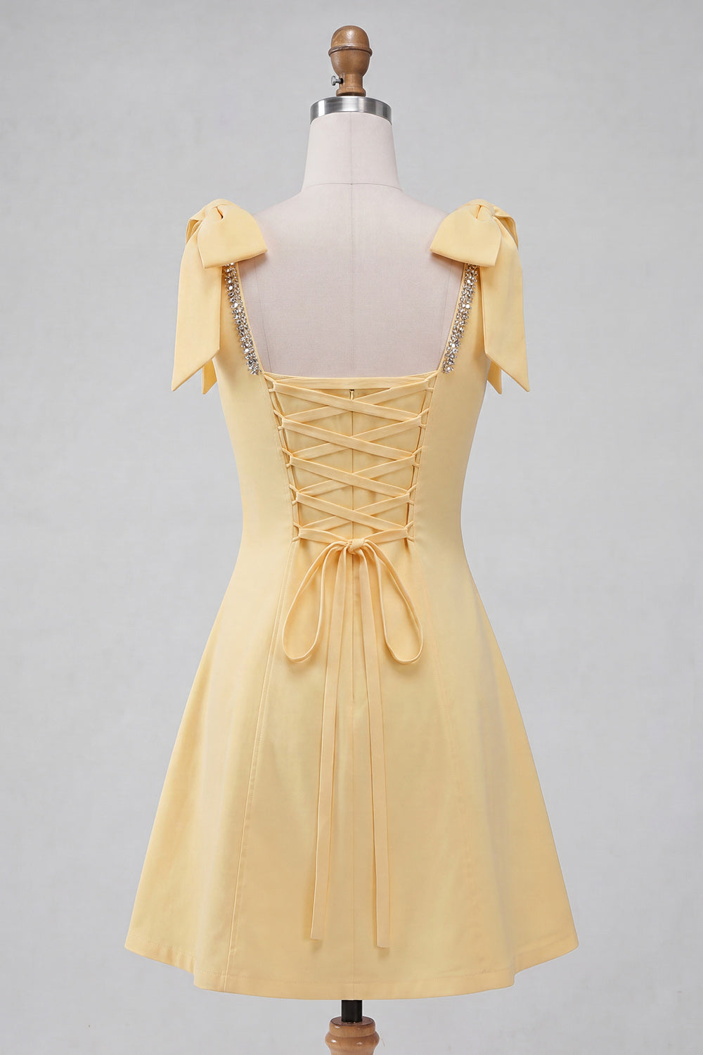 Light Yellow A-Line Bowed Straps Beaded Homecoming Dress with Lace Up Back