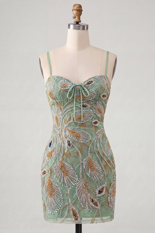 Robe courte de cocktail moulante verte ornée de perles avec dos lacé