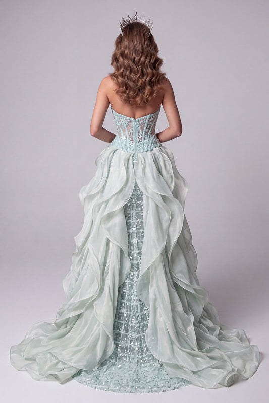 Robe longue de concours vert menthe sirène à bustier transparent avec paillettes et traîne à volants