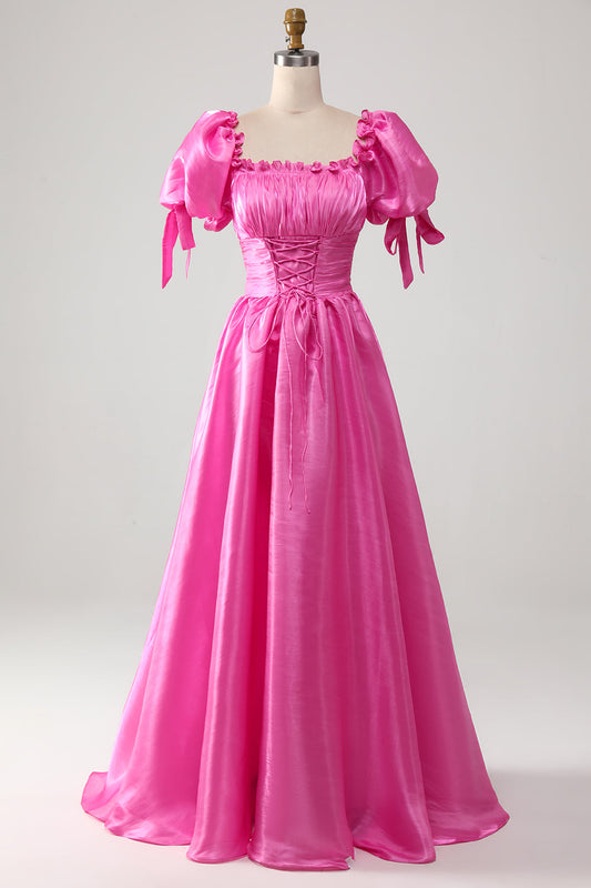 Vestido de fiesta rosa fuerte con volantes y mangas abullonadas