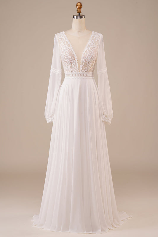 Robe de mariée ivoire à manches longues et dentelle