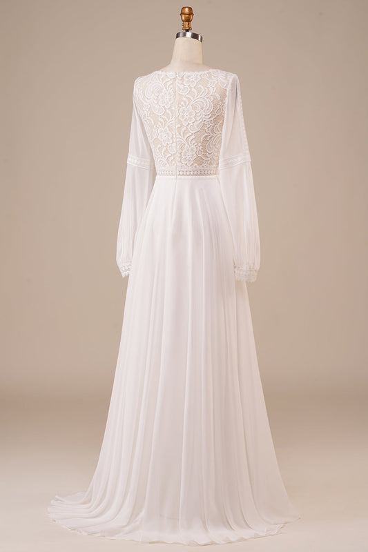 Robe de mariée ivoire à manches longues et dentelle