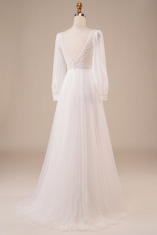 Robe de mariée ivoire évasée en tulle orné de perles avec manches