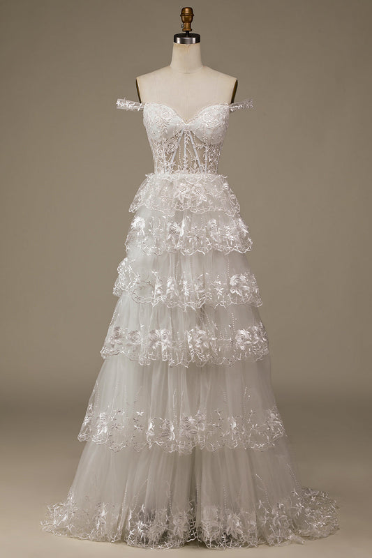 Robe de mariée bustier à volants en dentelle blanche pailletée avec fente